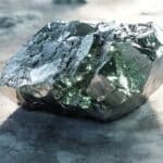 Terbium appears as a soft, silvery-gray metal with a smooth and slightly reflective surface, showcasing its malleability and ductility.