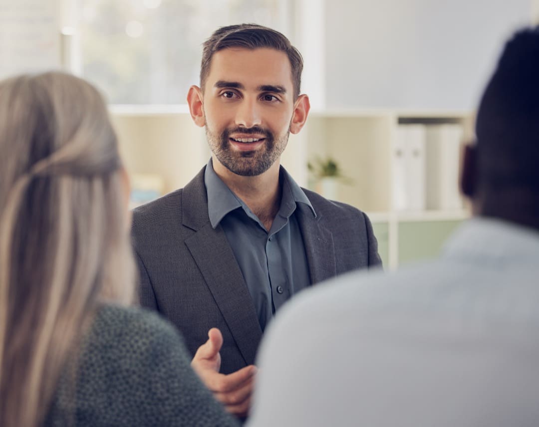 man talking to a woman in a room