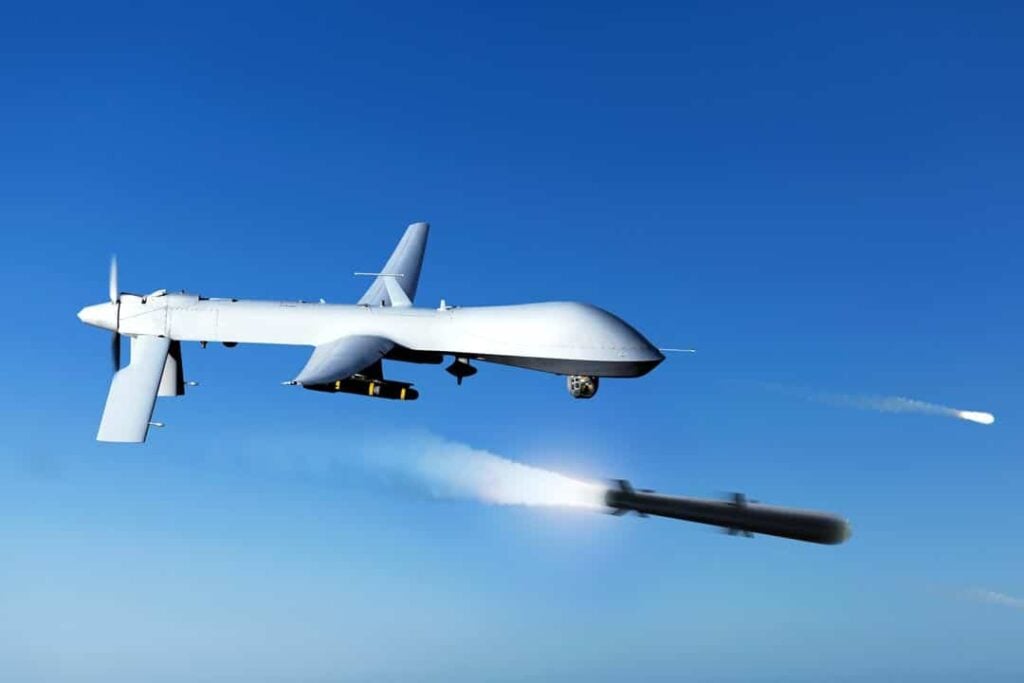 large white airplane flying through a blue sky