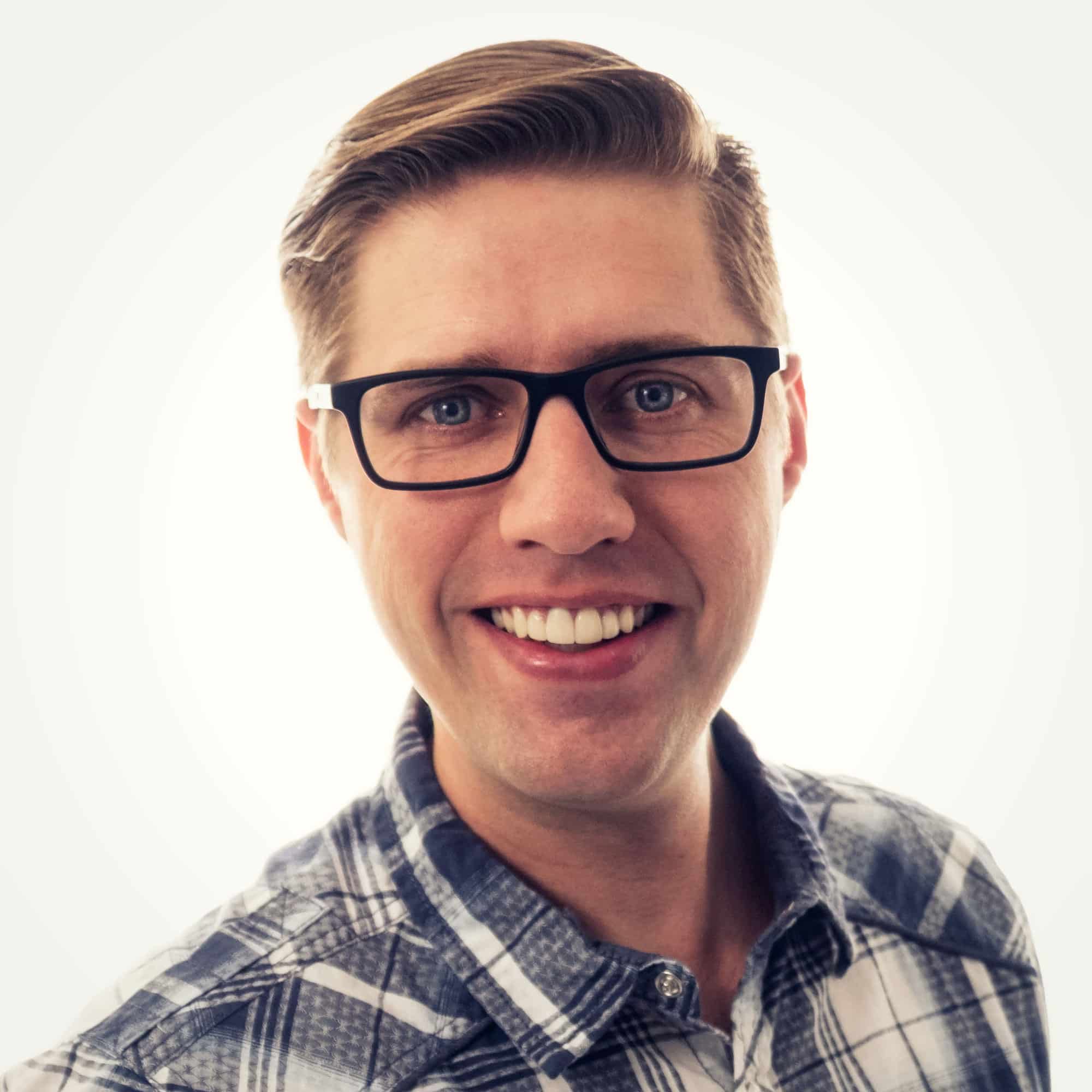 man wearing glasses and a plaid shirt