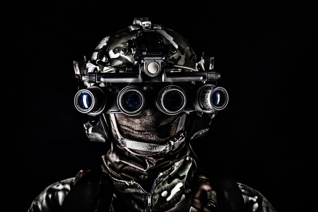 soldier-in-night-view-goggles-low-key-studio-shoot-2025-02-12-00-37-50-utc man wearing a helmet and goggles in the dark, highlighting the importance of rare earth elements in defense technology